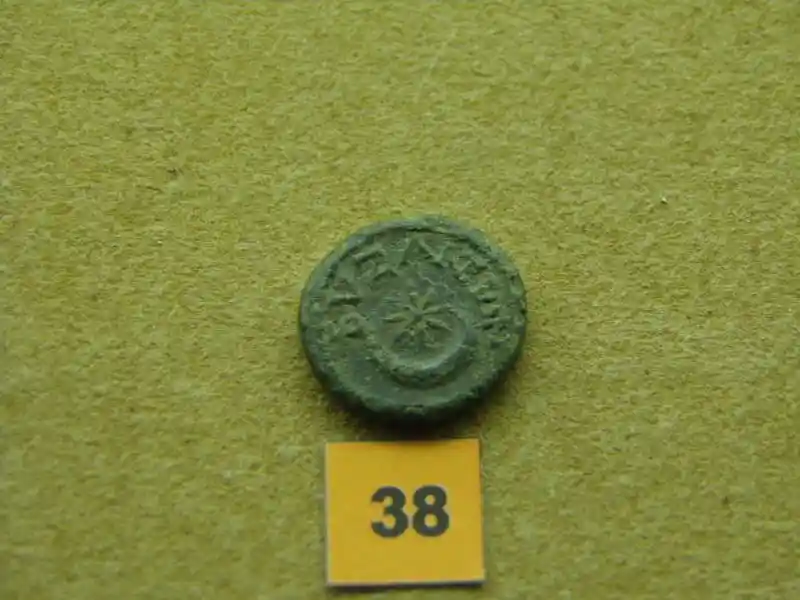 Metal coin, sun on crescent, cross with rays